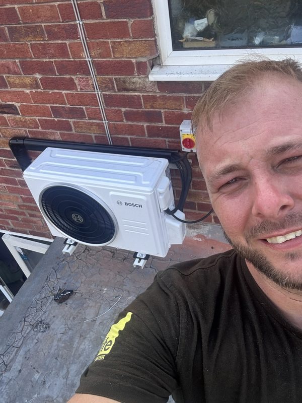 Steve from The Boiler Doctor with a finished air conditioning installation
