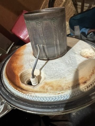 Burnt-out burner door from an Ideal Vogue boiler