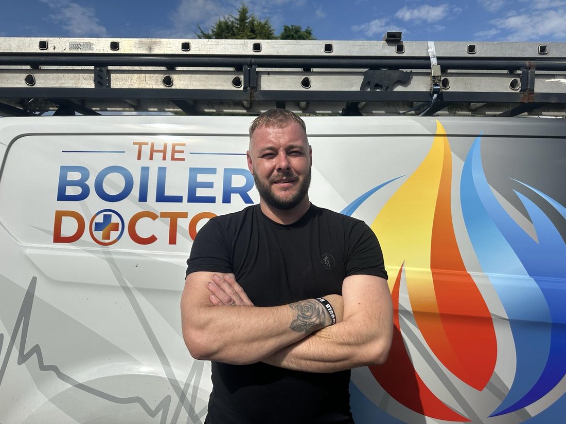 Steve, owner of The Boiler Doctor, in front of the branded company van